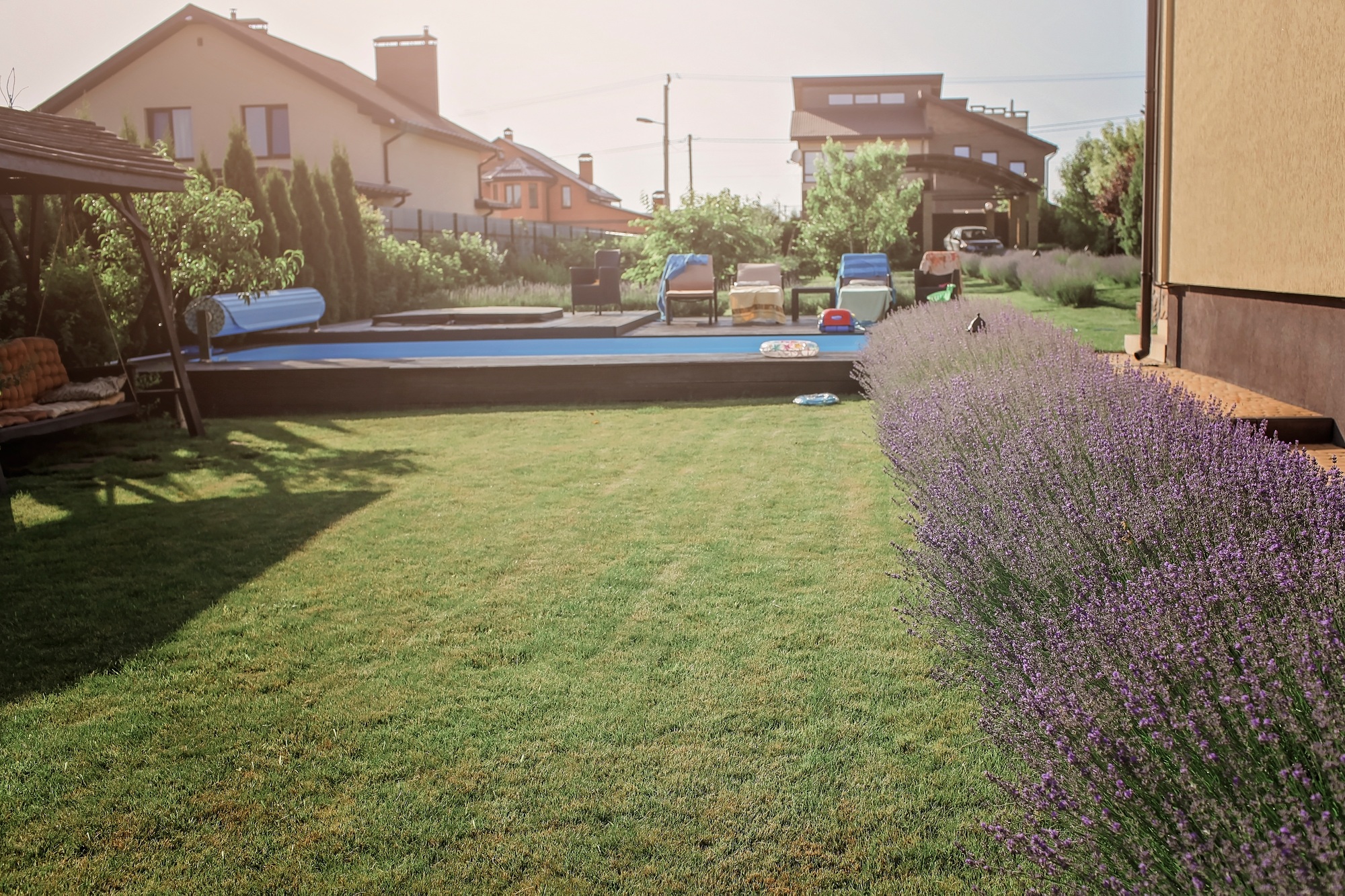 Green garden outside of modern vacation house, creation a home and home feeling